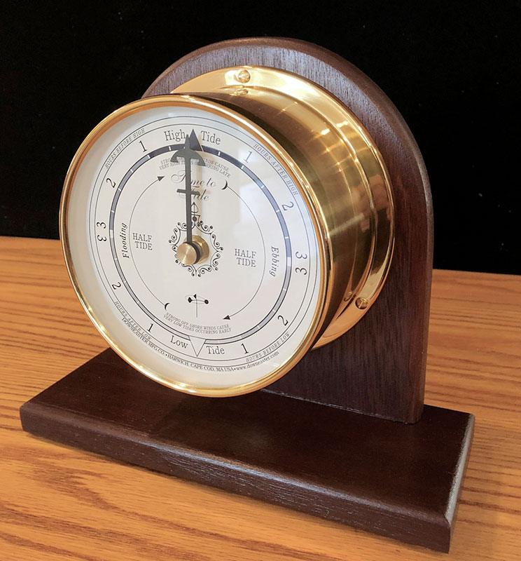 mantle stand made of hard wood holding a downeaster weather instrument